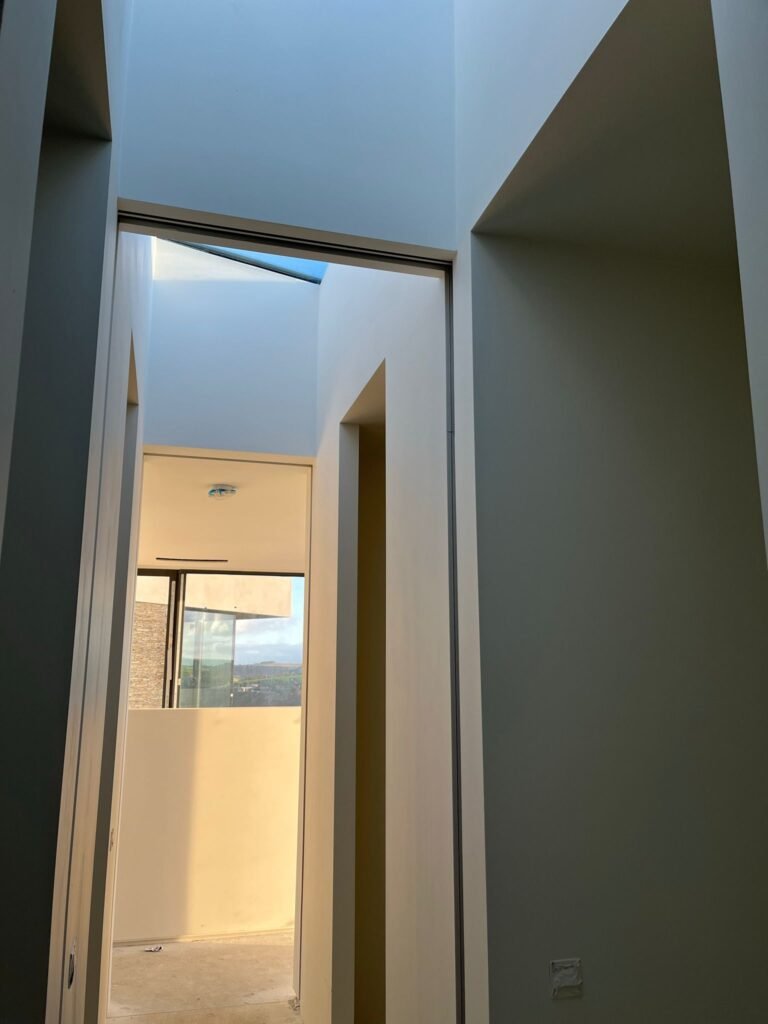 Builders in Cork installing modern energy‑efficient windows.

